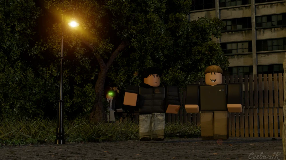Two figures on an asphalt path at dusk under a warm streetlamp, wooden fence behind, a third figure hiding behind a tree with glowing green eyes.